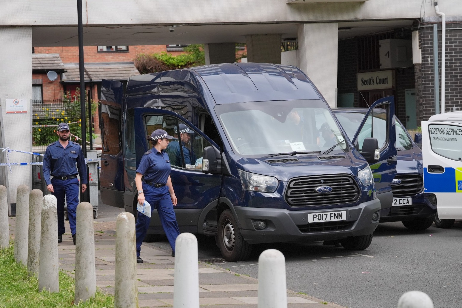 Man charged with murder over bodies found in suitcases as victims named 