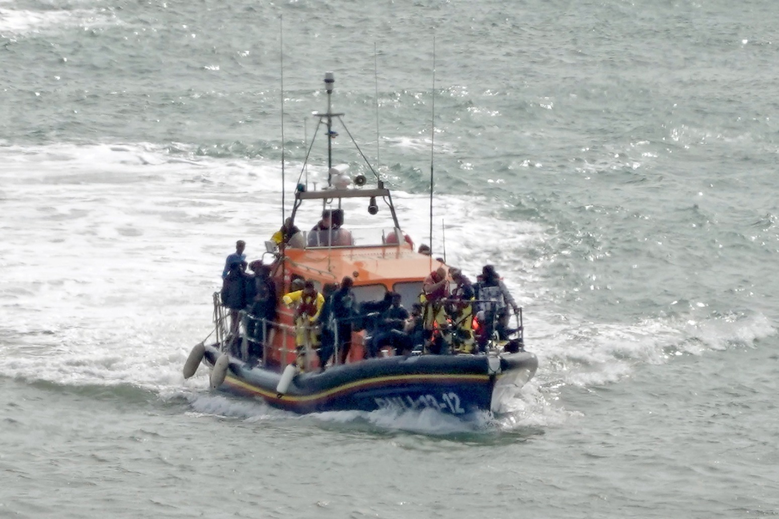 At least 13 dead after boat with dozens of migrants rips apart off French coast 