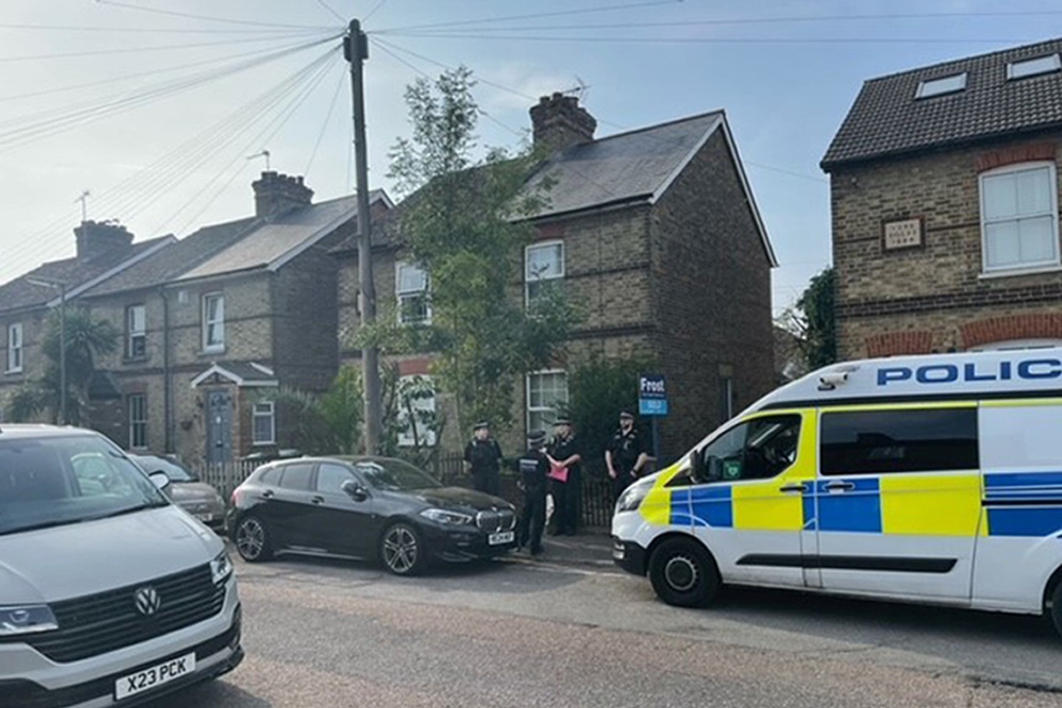 Floral tributes laid after man and three children found dead in house 